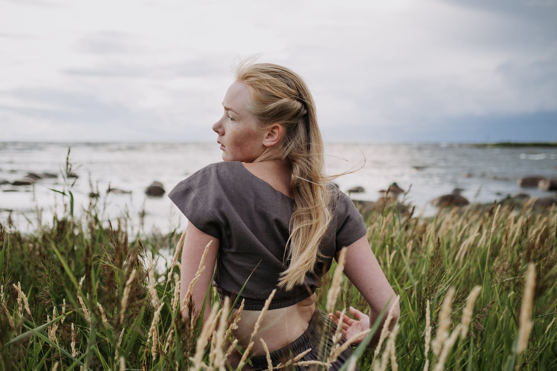 woman sitting on grass