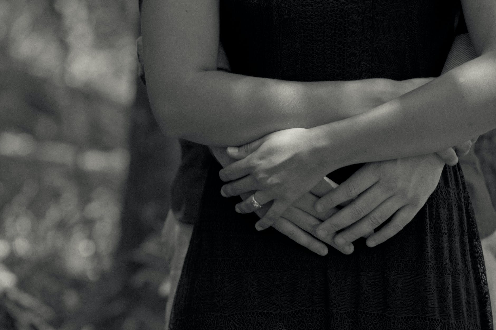 couple hugging in grayscale photography