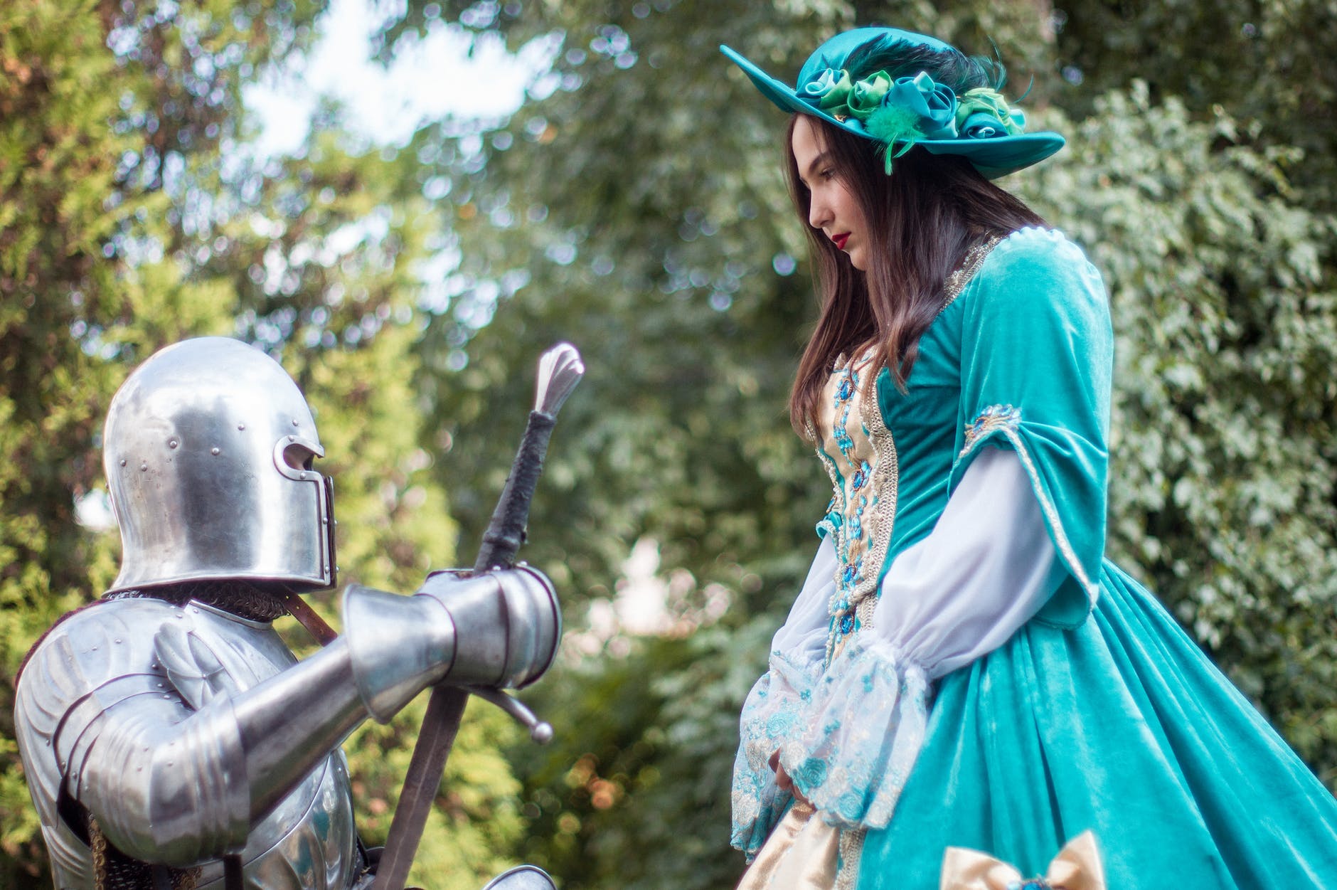 knight in front of woman in green dress