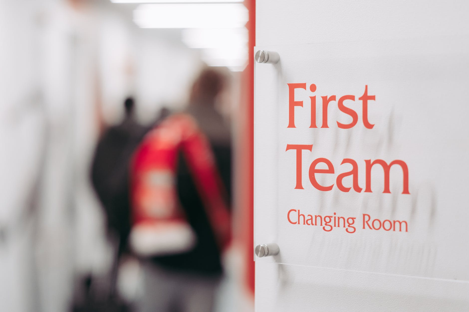 selective photography of first team changing room signage