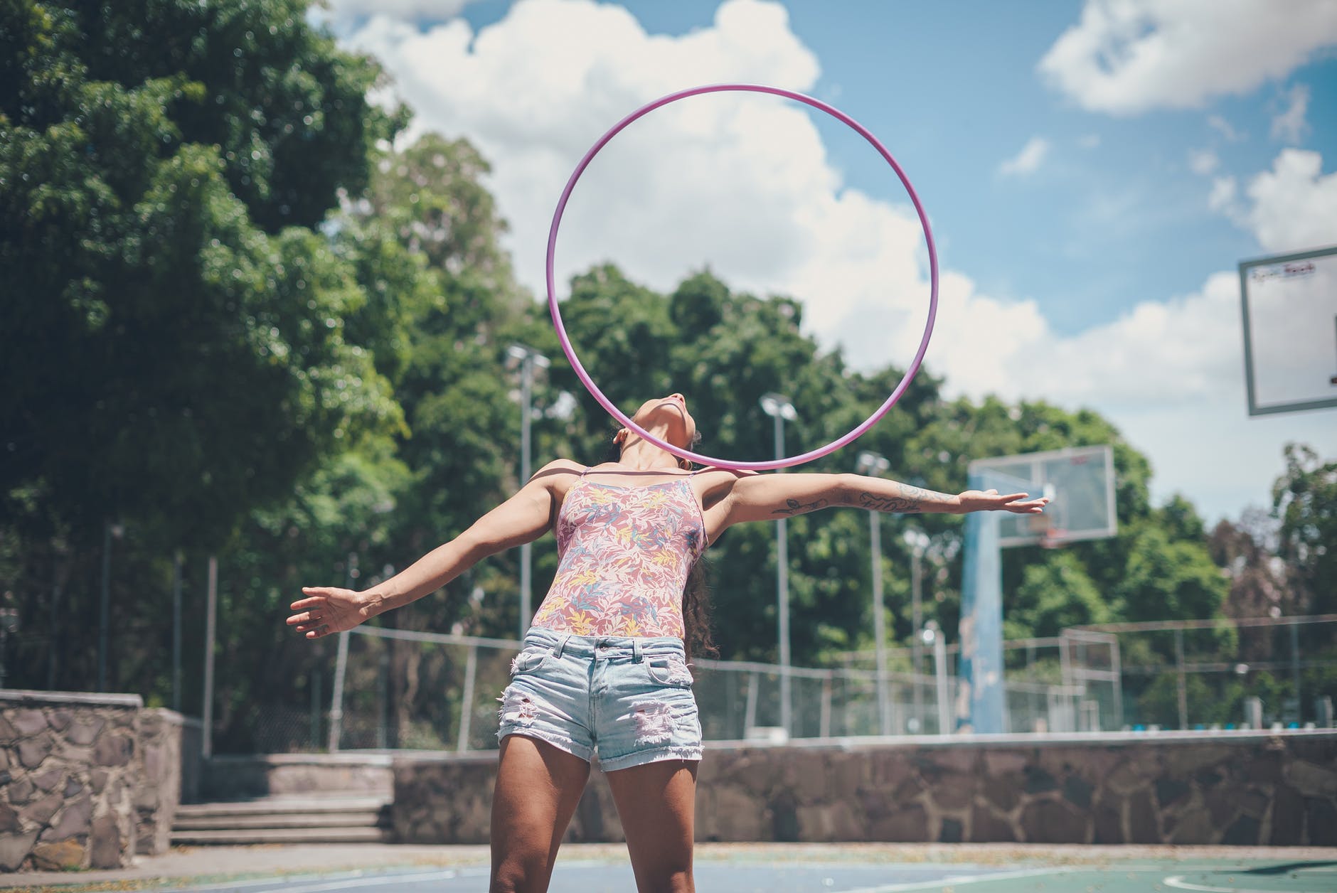 girl balancing a hula hoop